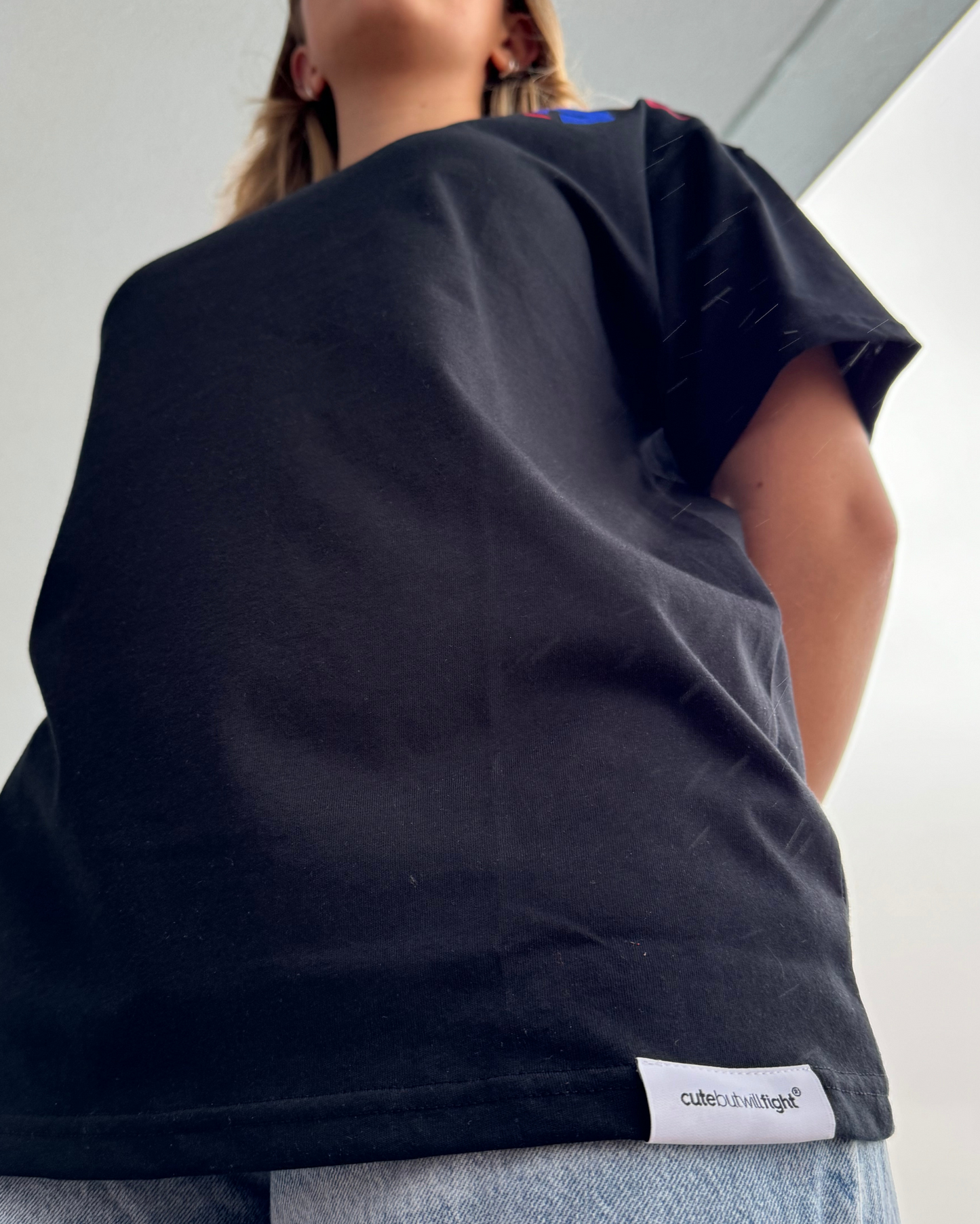 Fierce & Defiant: Black T-Shirt With Blue Helmet