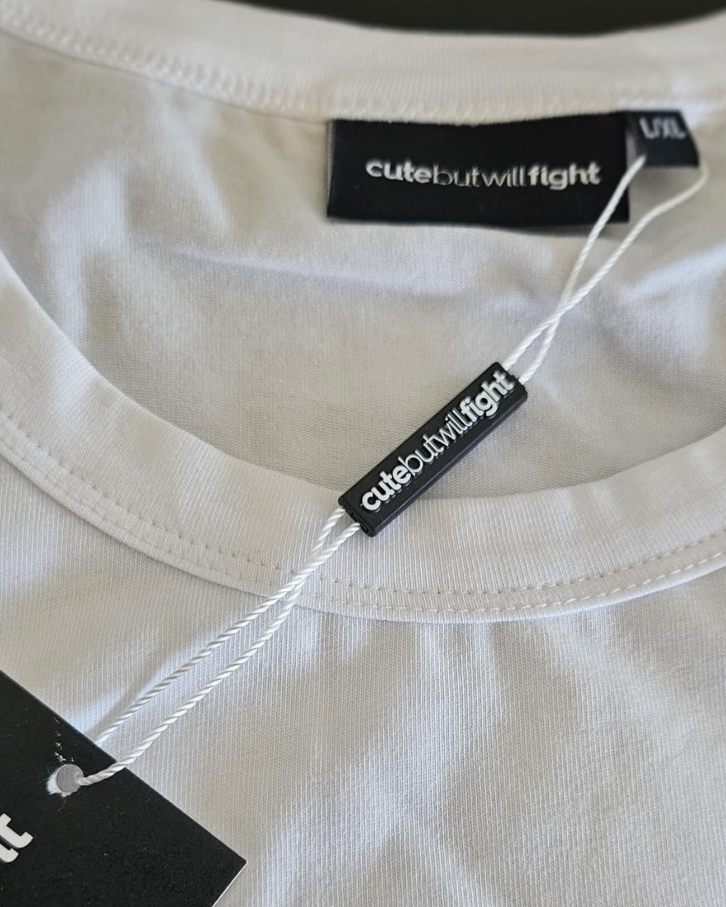 Beauty With Purpose: White T-Shirt With Blue Brass Knuckles