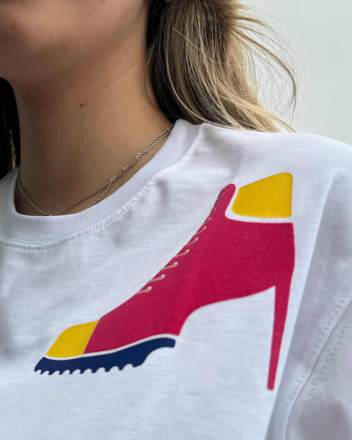 Power In Every Step: White T-Shirt With Red Boot